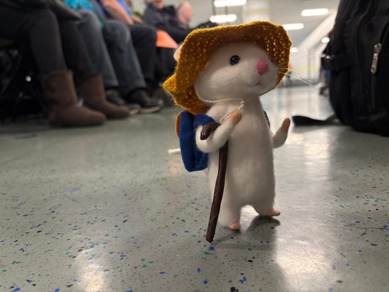 Toy mouse standing in airport