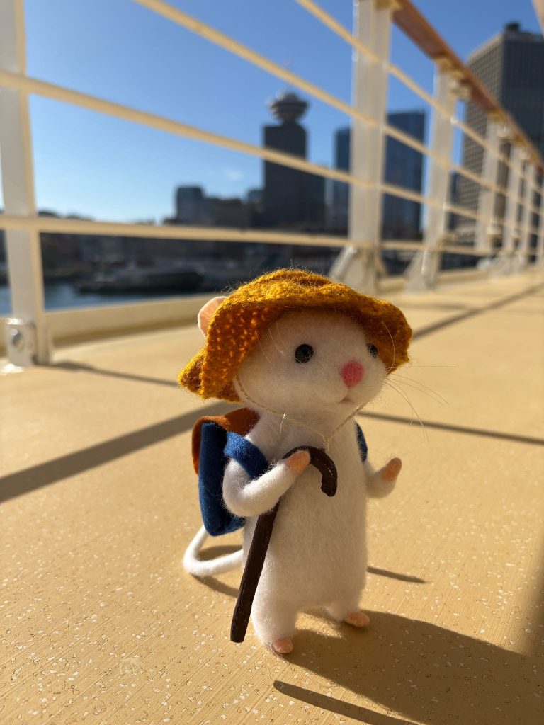 Mouse standing near boat dock