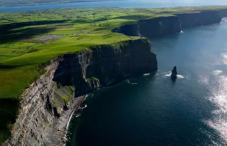 massive cliffs above oceanfront