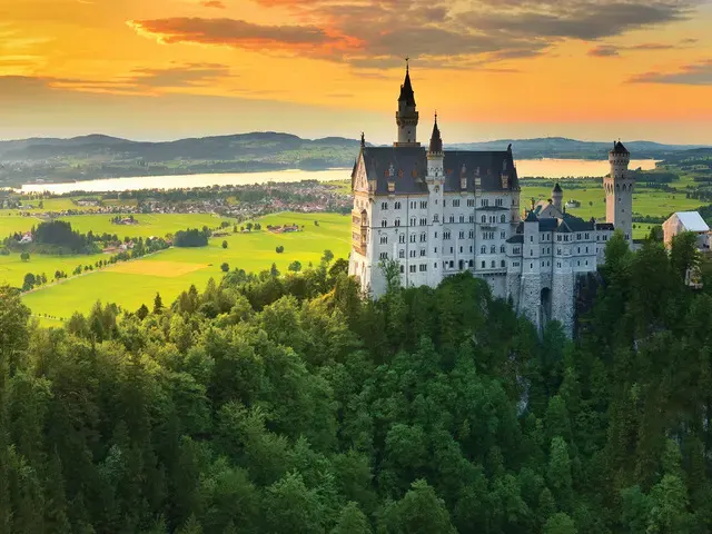 Neuschwanstein Castle above green forests in Bavaria, Germany